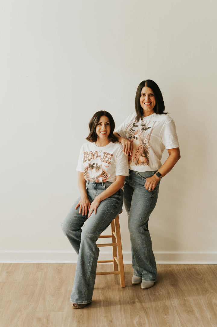 BOO JEE Bling T in white with leopard lettering and ghost graphic, styled with rhinestone wide-leg jeans
